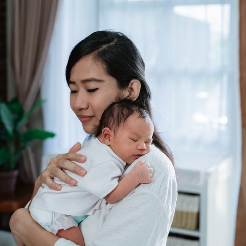 Mother using breast pump